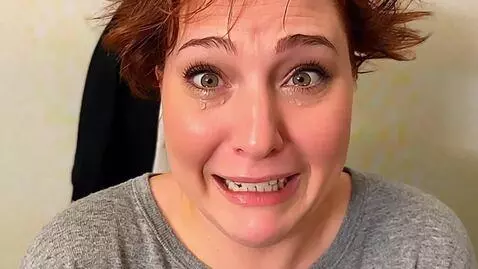 AI Video from prompt: She sobs hysterically while staying upright and 