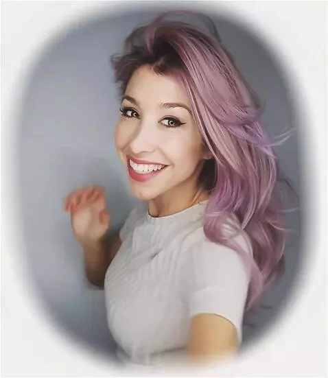 AI Video from prompt: she smiles to the camera, hold her hair and kiss