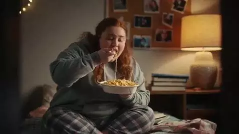 AI Video from prompt: a slim Irish woman goes to college in  America. 