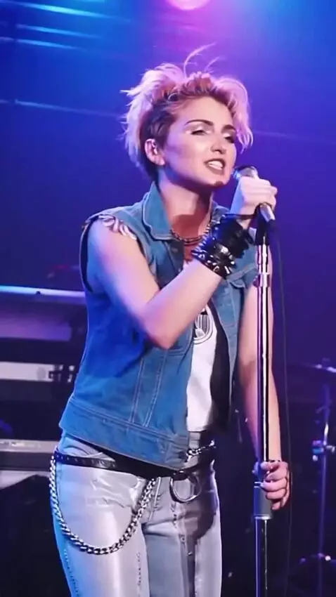 AI Video from prompt: Madonna sings and pirouettes around herself, the