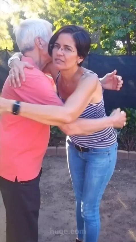 AI Video from prompt: The woman hugs the man and look to the camera
