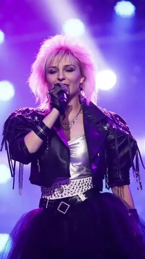 AI Video from prompt: Tanya in a  tutu skirt is singing and doing a pi