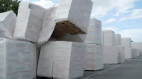 AI Video from prompt: A heavy white pallet falls to the ground with a 