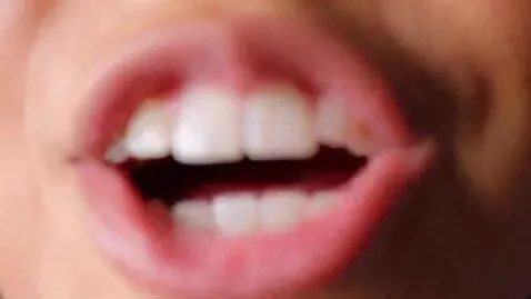 AI Video from prompt: Girl opens mouth and we fly inside her mouth pov
