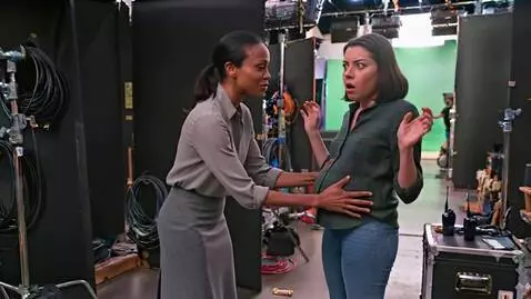 AI Video from prompt: A slim African American woman is rubbing the ver