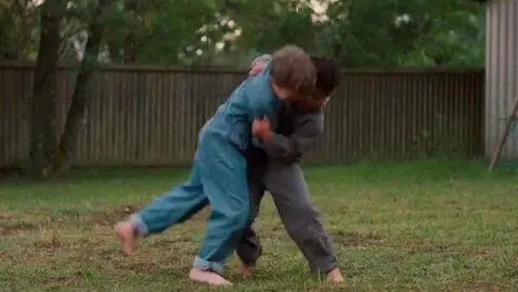 AI Video from prompt: two boys at six years,wearing  jumpsuits,barefoo