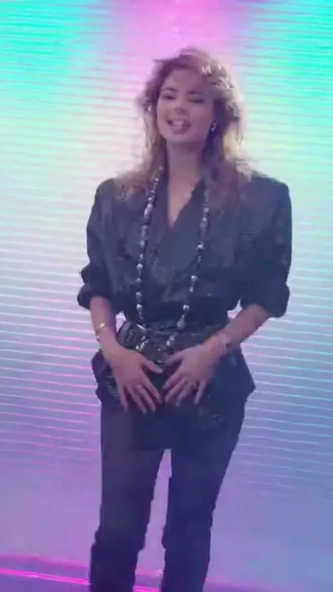 AI Video from prompt: Sandra sings and moves to techno music, spinning