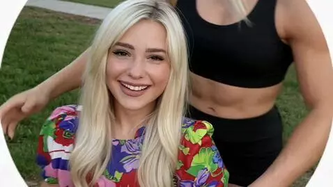 AI Video from prompt: A tall, muscular Amazon girl approaches the blon