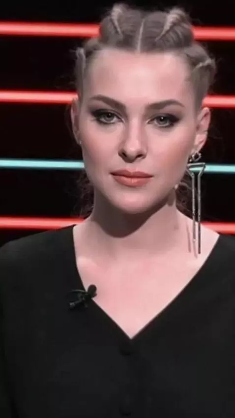 AI Video from prompt: The girl looks at the camera and slowly says the