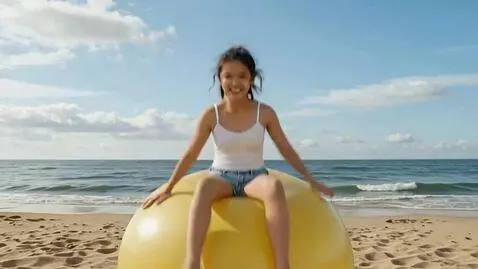 AI Video from prompt: An 18-year-old girl sits on a huge 250 cm beach 