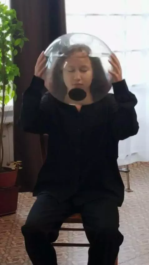 AI Video from prompt: The girl is sitting silently on a chair with her
