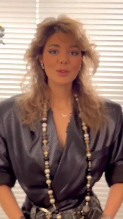 AI Video from prompt: The girl in the short skirt is adjusting her tig