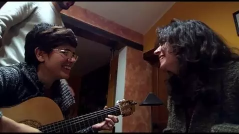 AI Video from prompt: Another short haired swinger wife hugs the women