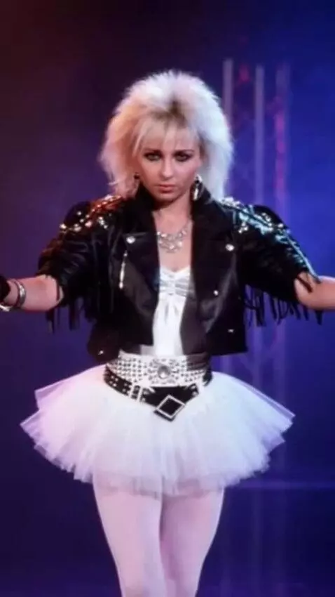 AI Video from prompt: A girl in a short tutu skirt performs a pirouett