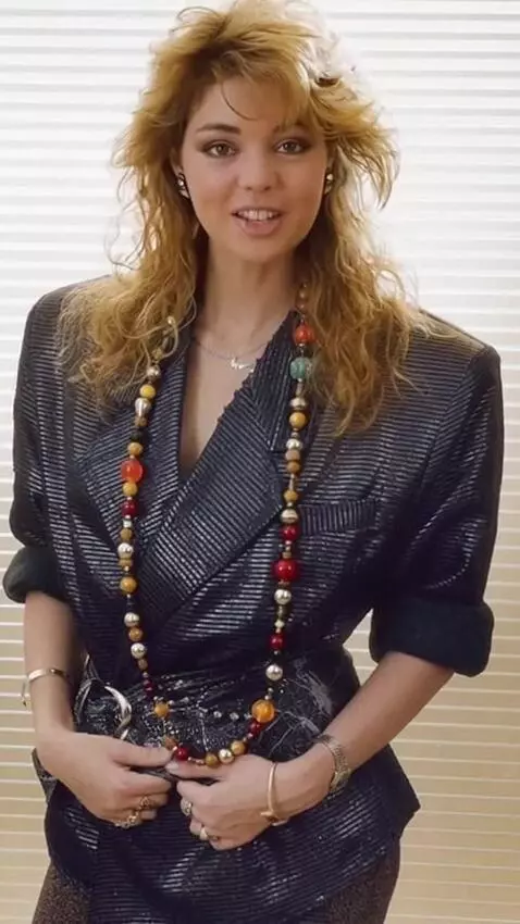 AI Video from prompt: The girl adjusts her short dress.