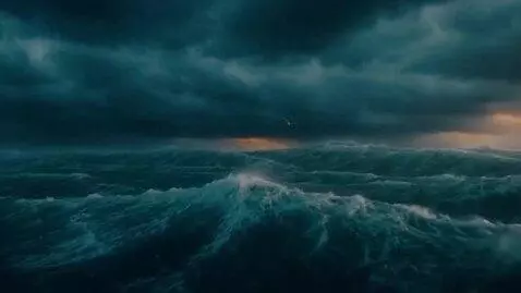 AI Video from prompt: The ocean, the storm — the camera slowly shows e