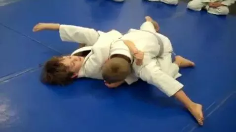 AI Video from prompt: two boys at six years,wearing ivory bjj jackets,