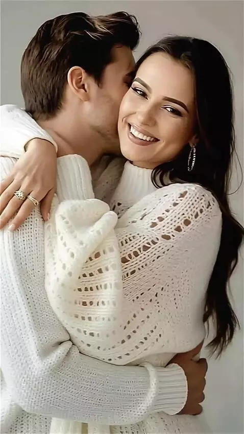 AI Video from prompt: She is smiling, and the man is hugging and kissi