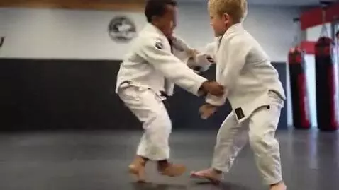 AI Video from prompt: two boys at six years,wearing ivory bjj jackets,