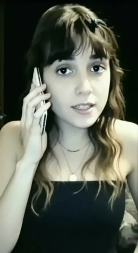 AI Video from prompt: A woman is talking on her smartphone in an old P
