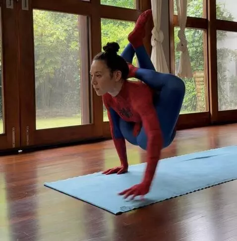 AI Video from prompt: A person in an advanced yoga pose ,remains in th