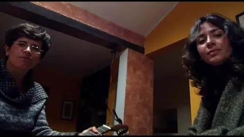 AI Video from prompt: The woman put the guitar down and both women sho