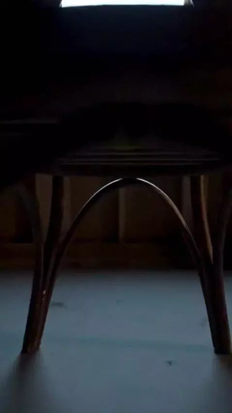AI Video from prompt: A front view on a Wooden Chair which is made of 