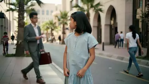 AI Video from prompt: An Asian girl in Islamabad street where money pe