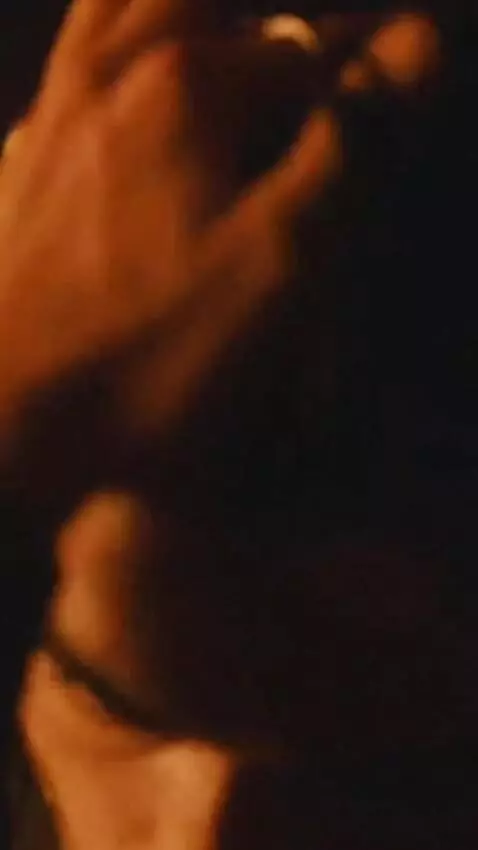 AI Video from prompt: Vertical 9:16 cinematic video, obsessive smolder