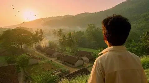 AI Video from prompt: A peaceful Indian village surrounded by a lush g