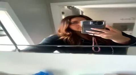 AI Video from prompt: Her chest suddenly grows to a gigantic size