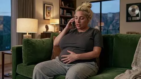 AI Video from prompt: A chubby and bloated blonde American woman sits 