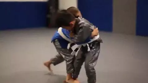 AI Video from prompt: two boys at six years,wearing metallic bjj jacke