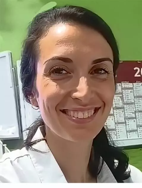 AI Video from prompt: A woman smiles against the backdrop of a seaside