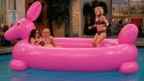 AI Video from prompt: The woman on the right lands on the pink inflata