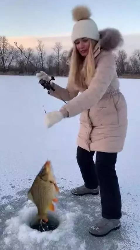 AI Video from prompt: A girl with a model‑like appearance fishes with 