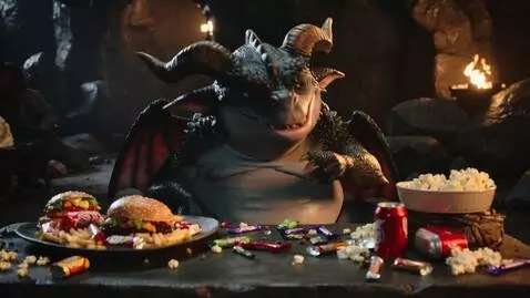 AI Video from prompt: A obese female dragon lazily stuffing her face w