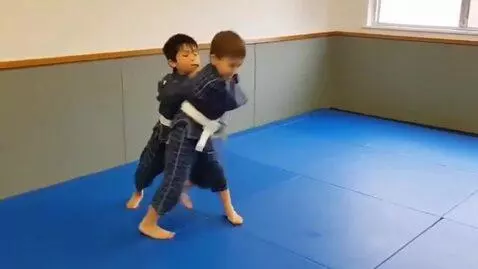 AI Video from prompt: two boys at six years,wearing squared bjj jacket
