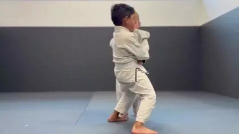 AI Video from prompt: two boys at six years,wearing beige bjj jackets,