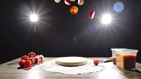 AI Video from prompt: prompt_name: "Pizza Assembly Burst" base_style: 