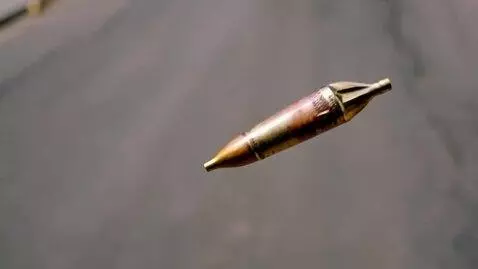 AI Video from prompt: Macro shot: .45 Colt lead projectile ONLY (no ca