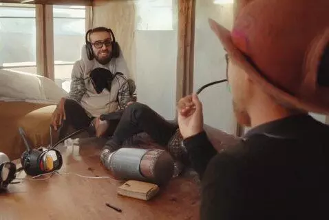 AI Video from prompt: Cabin conversation podcast style