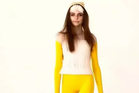 AI Video from prompt: A Russian cute face girl walking in yellow leggi