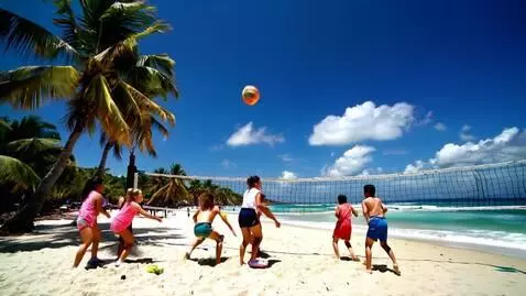 AI Video from prompt: Kids  playing beach volleyball in Brazil