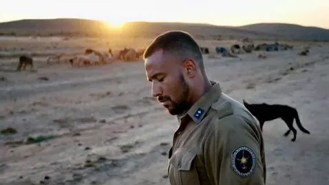 AI Video from prompt: A Ghanaian military officer returning home tired