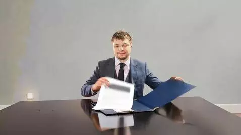 AI Video from prompt: Make a video  where a man opens a folder, takes 