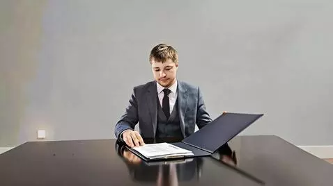 AI Video from prompt: Make a video  where a man opens a folder, takes 