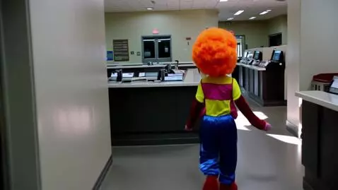 AI Video from prompt: A clown robbing a bank