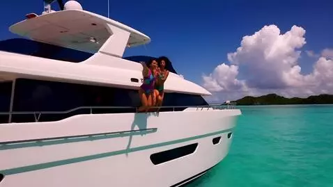 AI Video from prompt: On a yacht in the middle of the Caribbean two yo