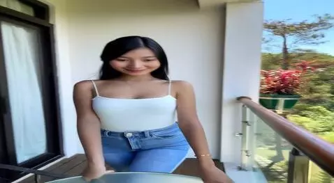 AI Video from prompt: She waving her hands to the camera with her big 